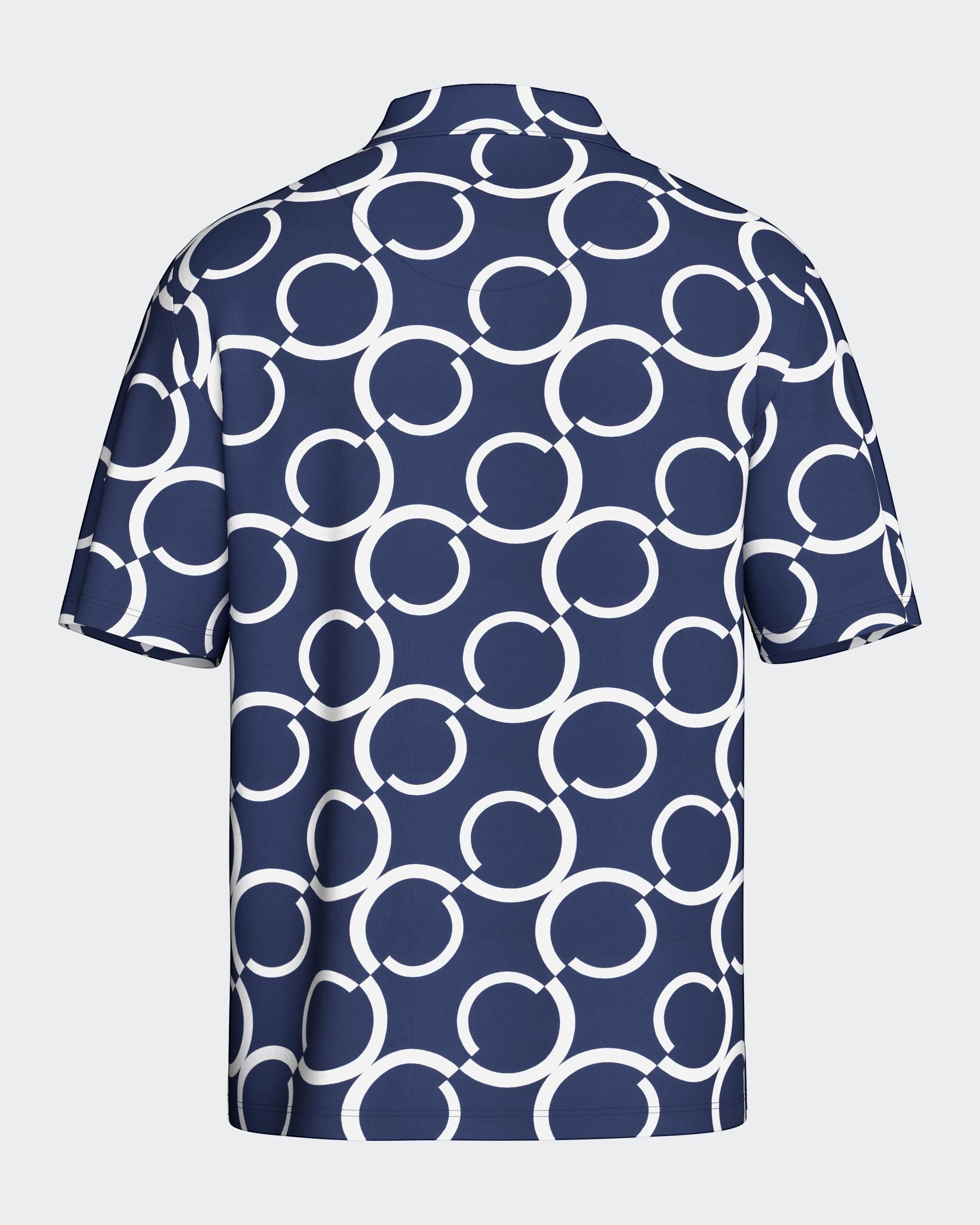 Maison Sarava navy and white geometric print short sleeve resort shirt with open collar.