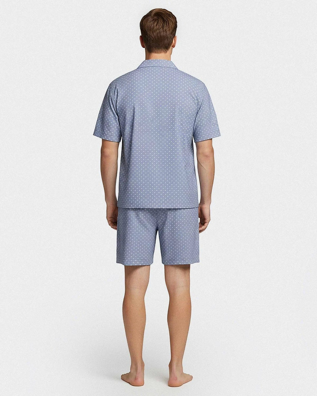 Maison Sarava men's light blue cotton lounge set with white polka dots. Short sleeve shirt and shorts.