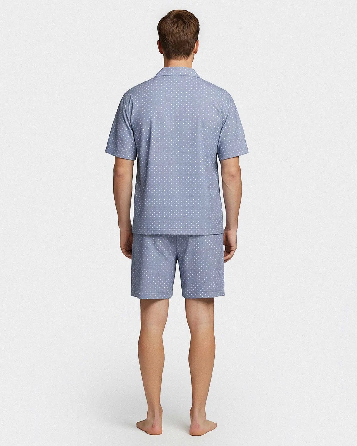 Maison Sarava men's light blue cotton lounge set with white polka dots. Short sleeve shirt and shorts.