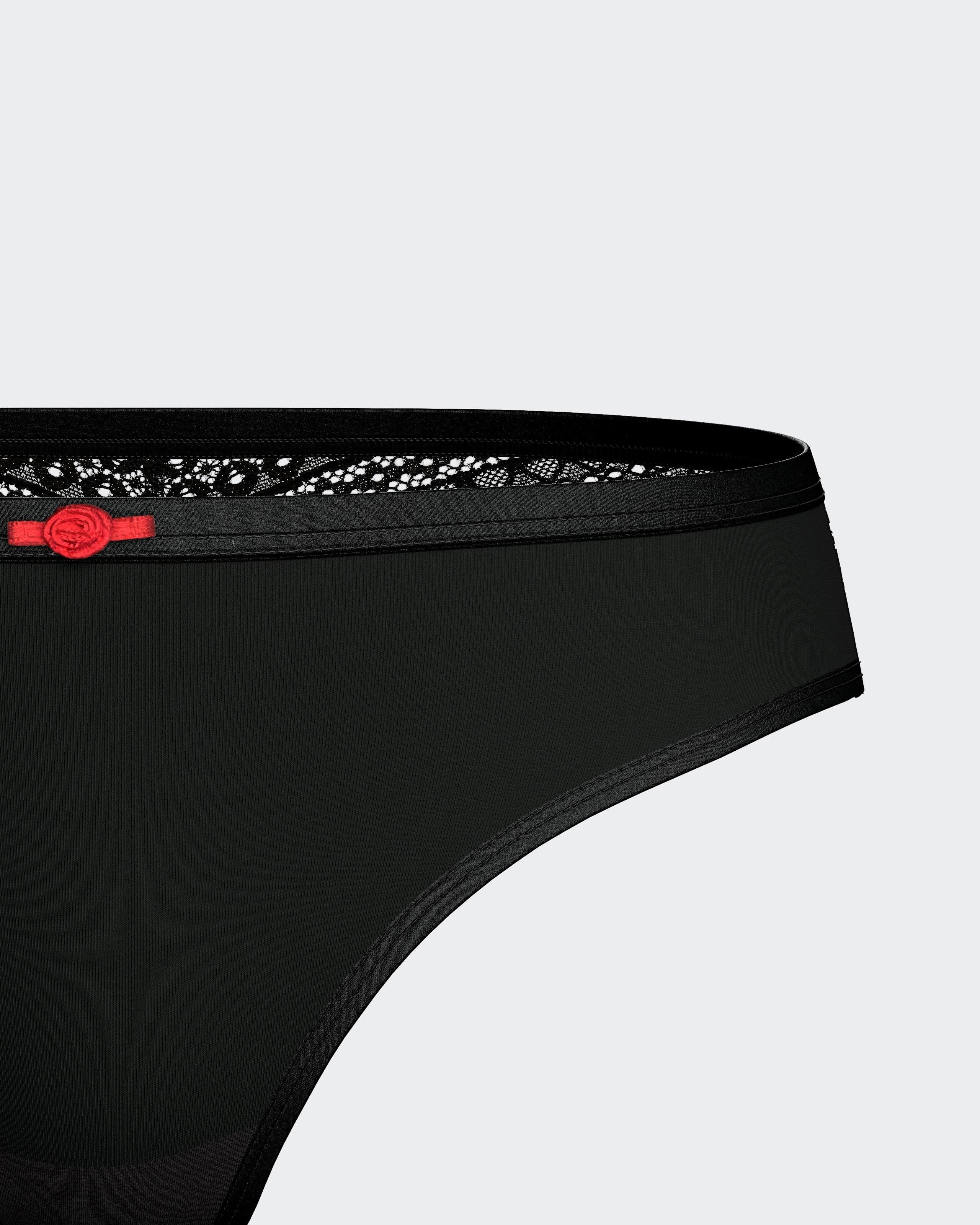 Maison Sarava black Lyocell thong with lace trim and red bow detail.