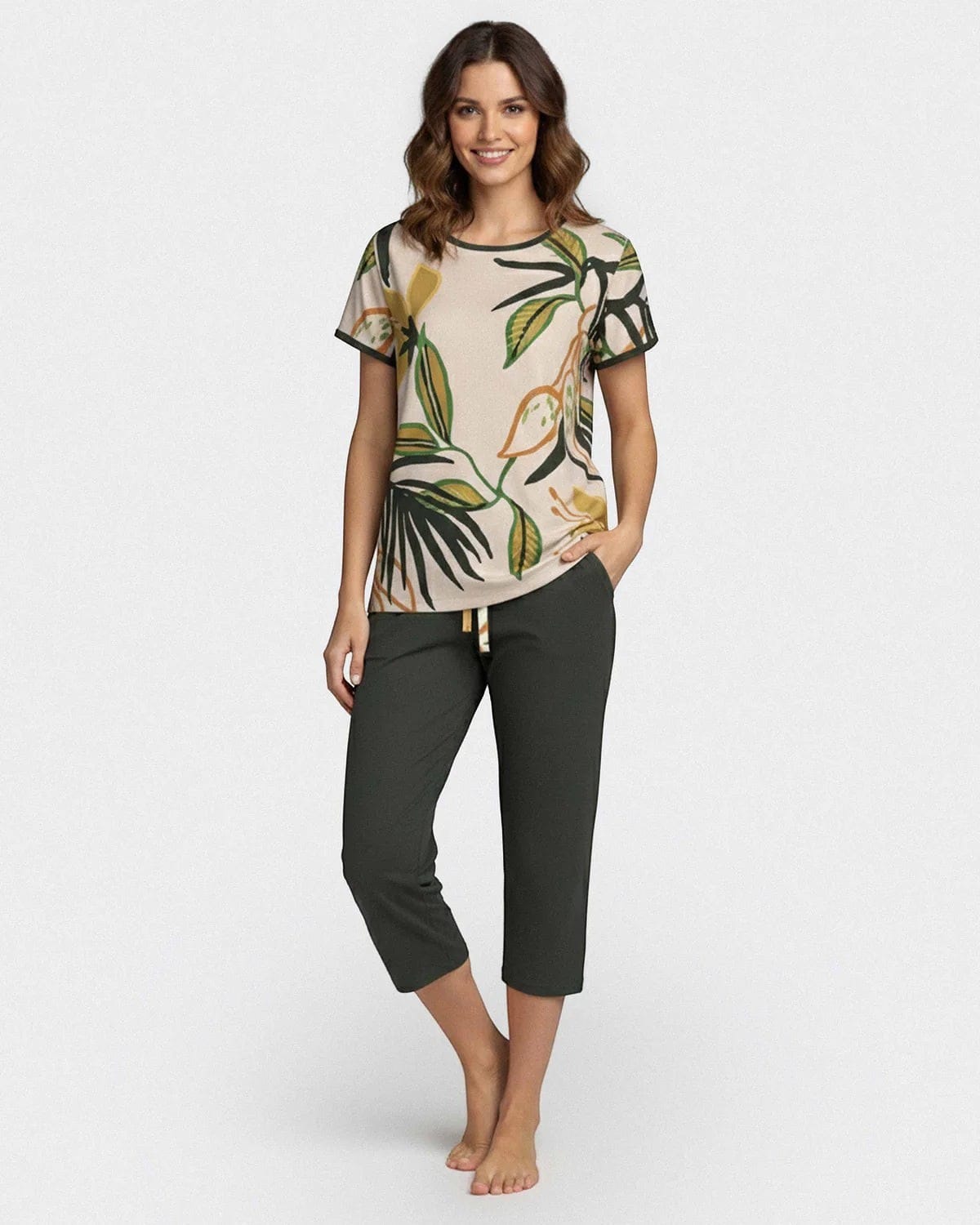 Maison Sarava women's beige lounge set with tropical print short sleeve top and dark green capri pants. Made from TENCEL Lyocell.
