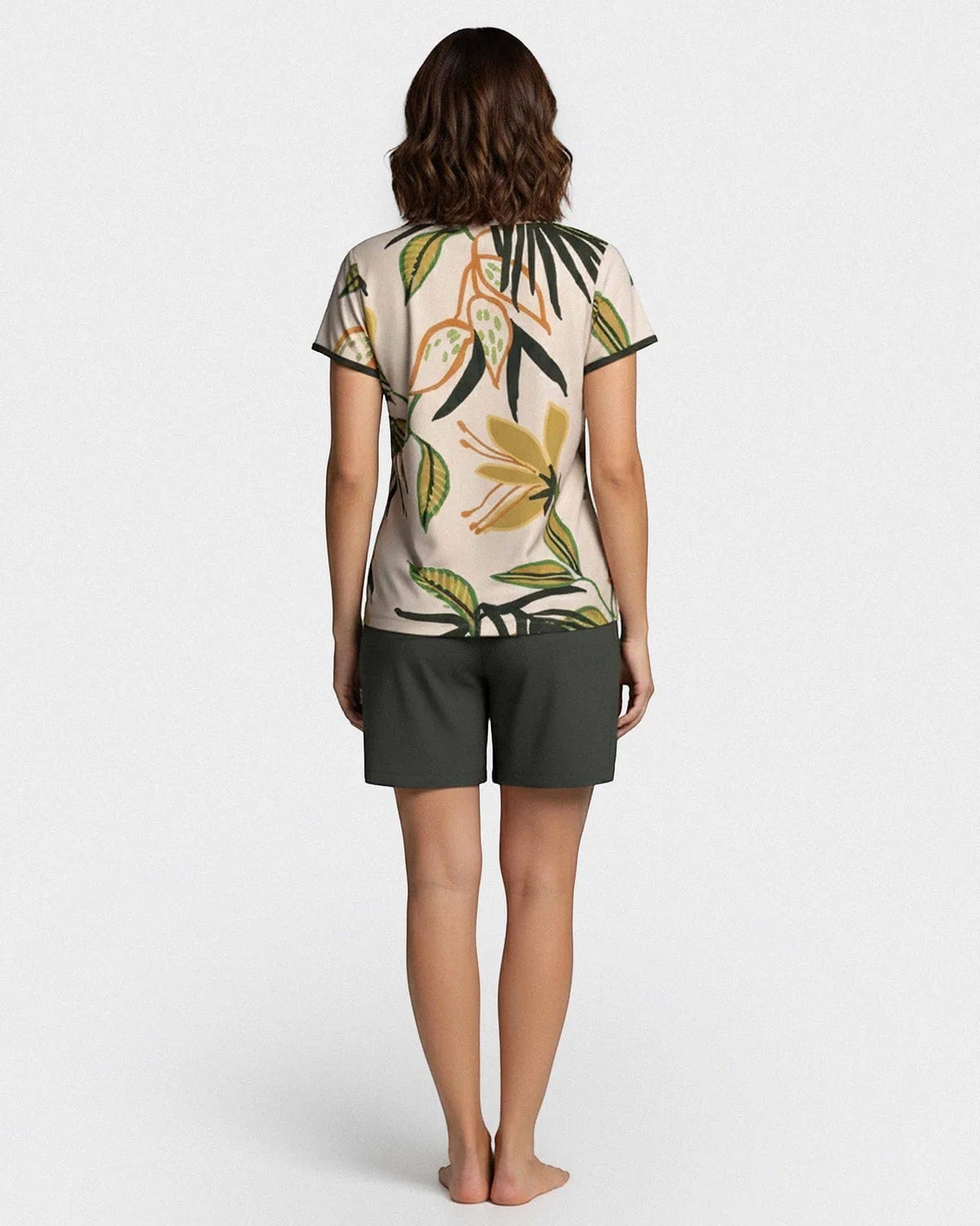 Maison Sarava women's short sleeve lounge set with tropical print top and plain dark green shorts made of Lyocell.