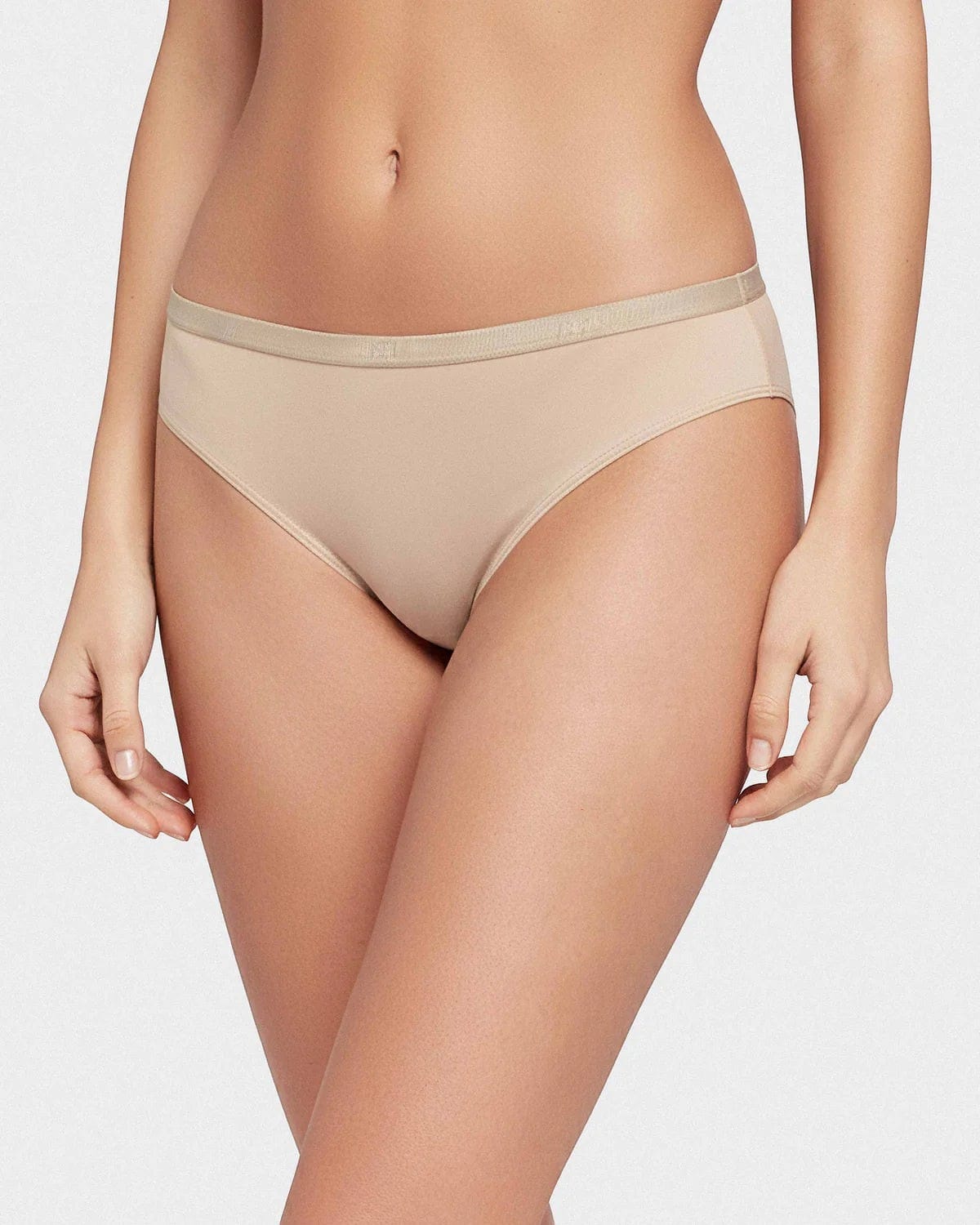 Maison Sarava women's beige thong underwear made from soft Lyocell with an elasticated waistband.