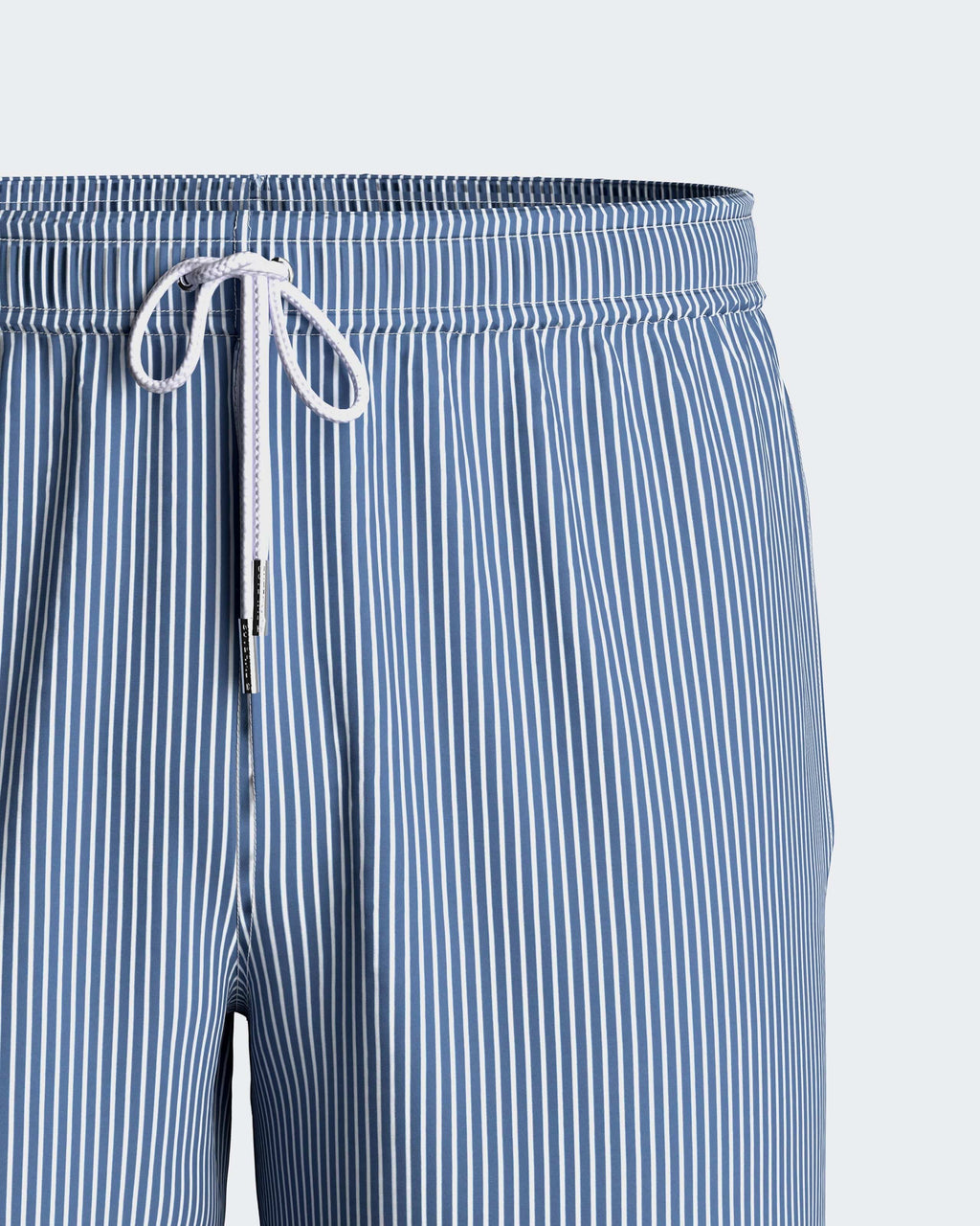Maison Sarava blue and white striped men's swim shorts with drawstring and pockets.