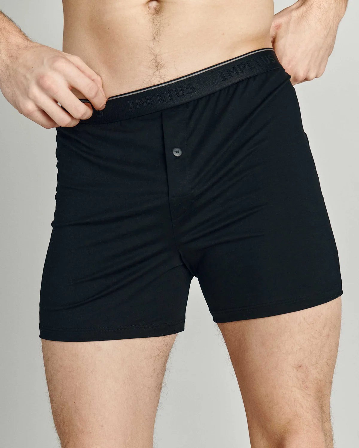 Maison Sarava black cotton boxer briefs with button fly and branded elastic waistband.