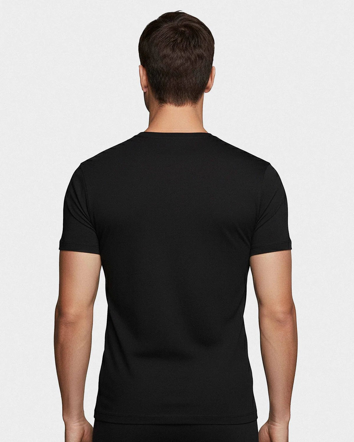 Maison Sarava black crew neck t-shirt made from soft cotton, shown from the back on a male model.