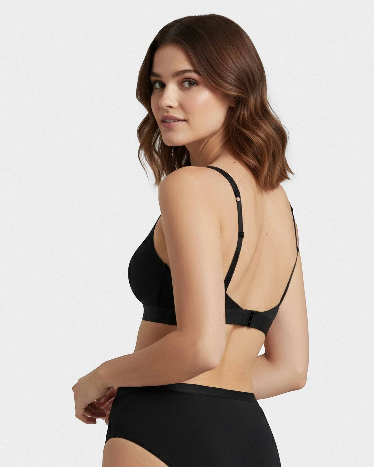 Maison Sarava black non-wired triangular bra in Lyocell with adjustable straps, offering comfort and breathability.