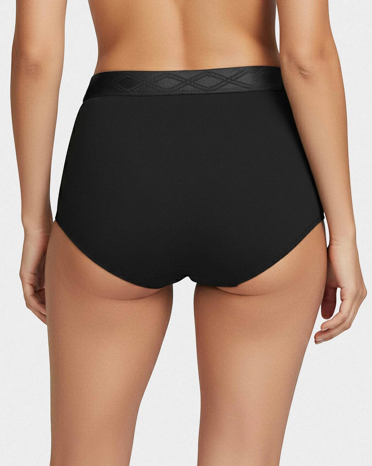 Maison Sarava black high-waisted briefs in TENCEL™ Lyocell with satin elastic waistband and diamond pattern.