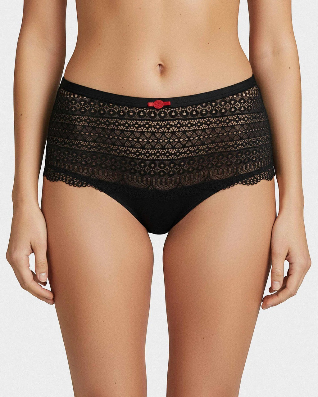 Maison Sarava black hipster brief underwear with intricate lace detailing and a small red bow accent.