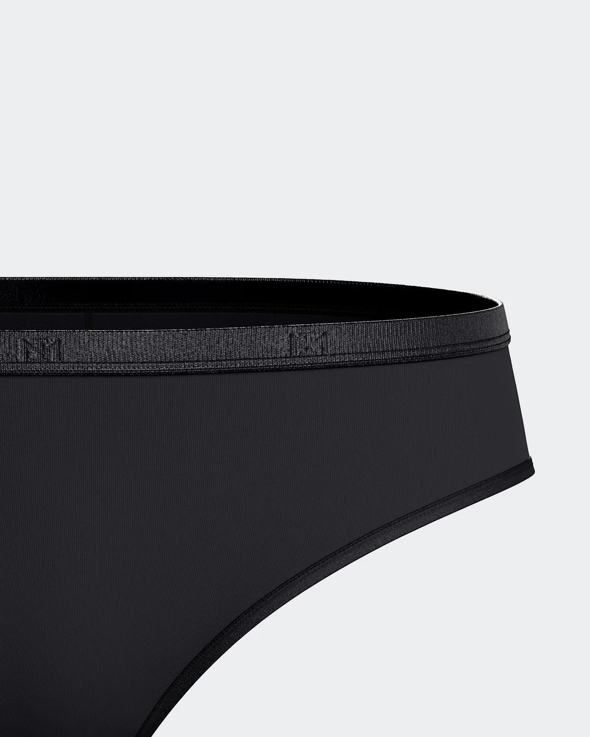 Maison Sarava black thong in soft TENCEL Lyocell with elasticated waistband and subtle branding.