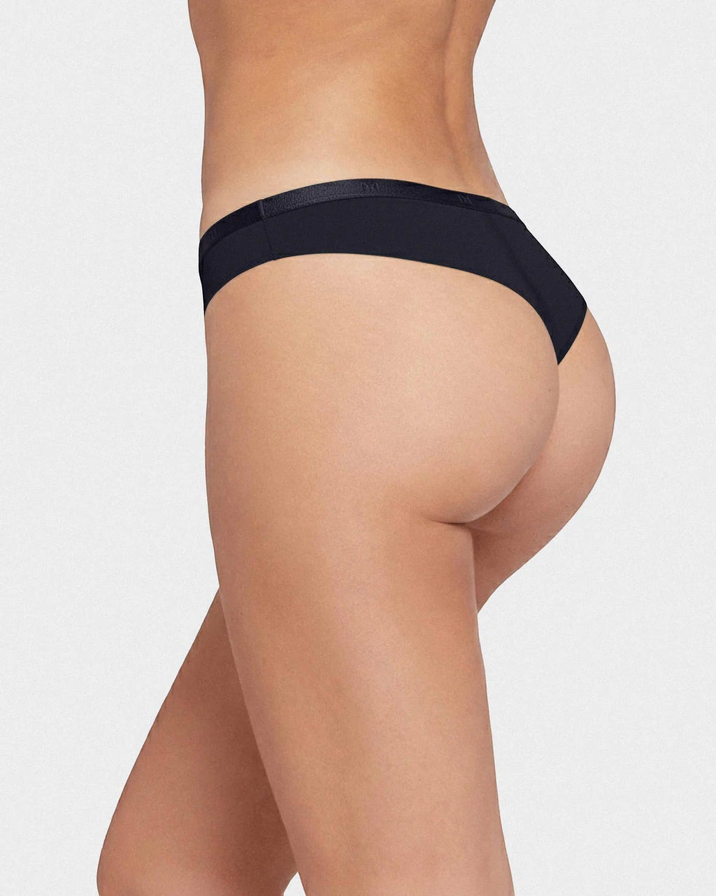 Maison Sarava black thong underwear made from TENCEL Lyocell with an elasticated waistband.