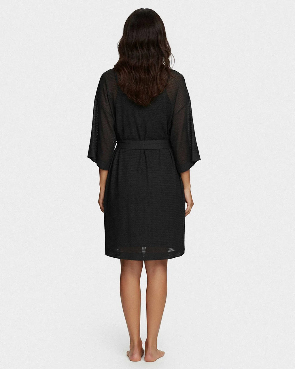 Maison Sarava black waffle knit kimono robe with wide sleeves and self-tie belt, shown from the back.