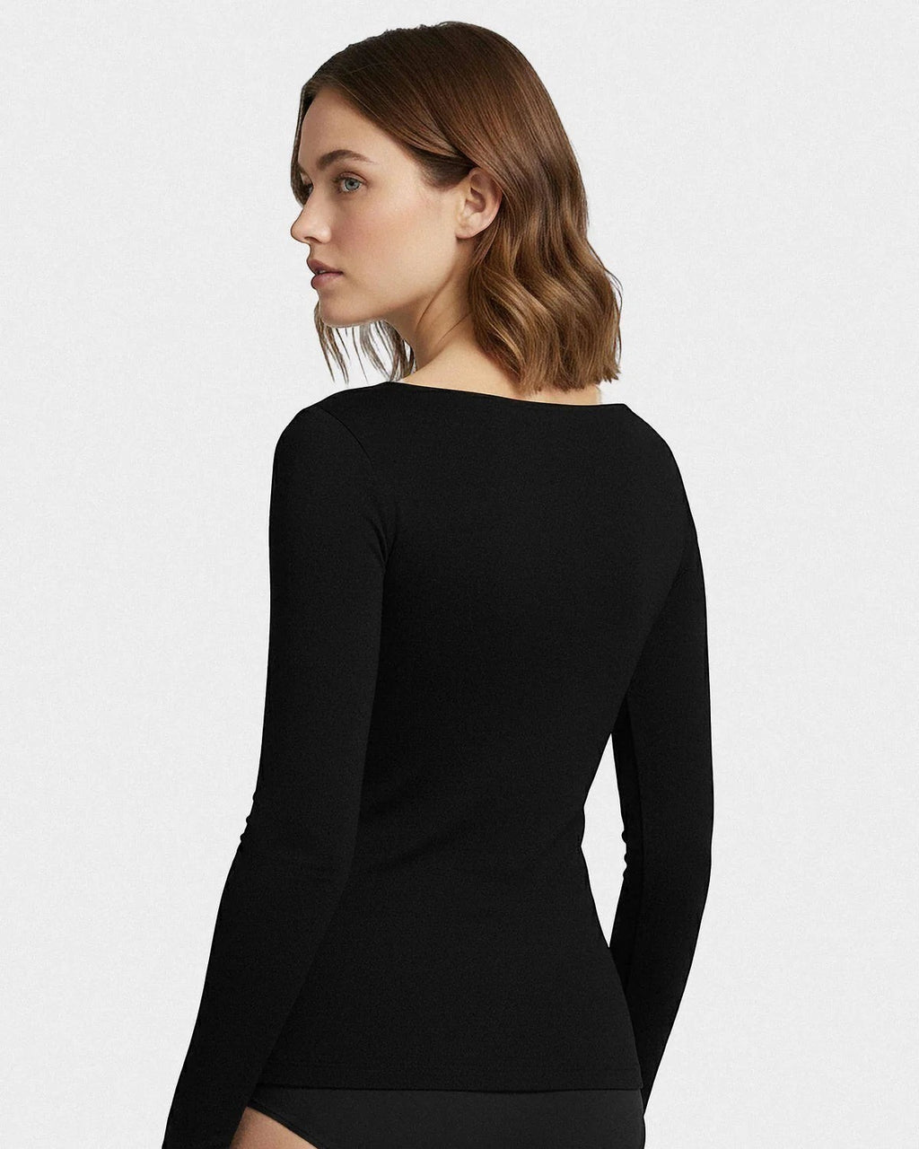 Maison Sarava black long sleeve scoop neck tee made from a soft blend of Merino wool and Lyocell, ideal for layering.