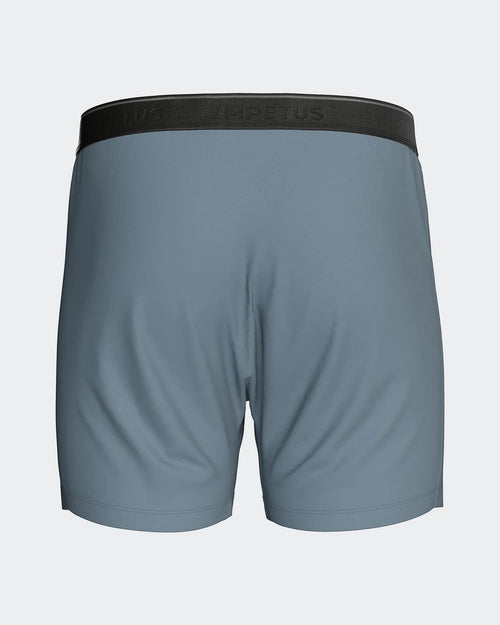 Maison Sarava blue classic boxer briefs with black branded elastic waistband and functional button fly.