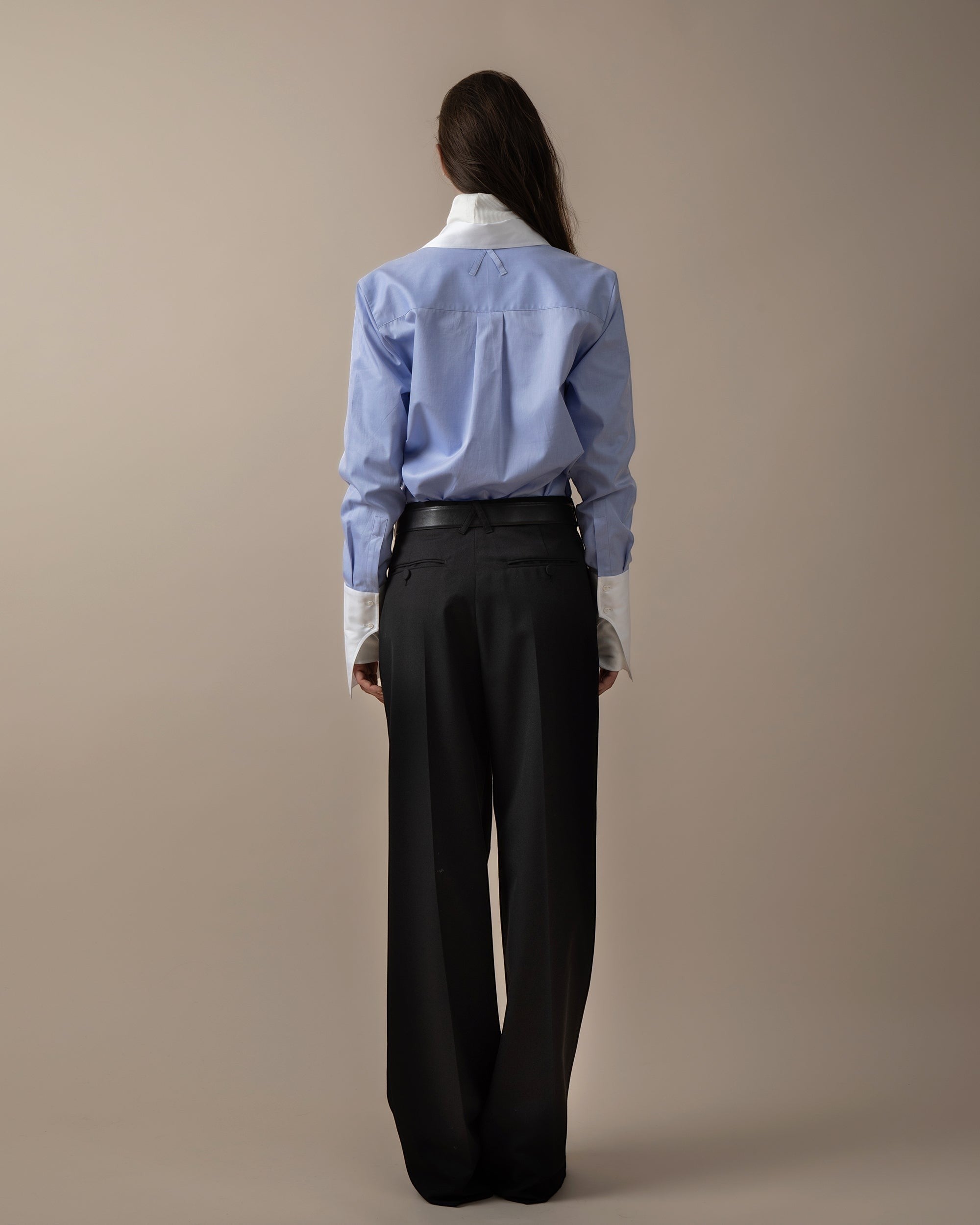 Maison Sarava women's fitted blue striped shirt with white collar and cuffs, featuring a box pleat back and A-design loops.