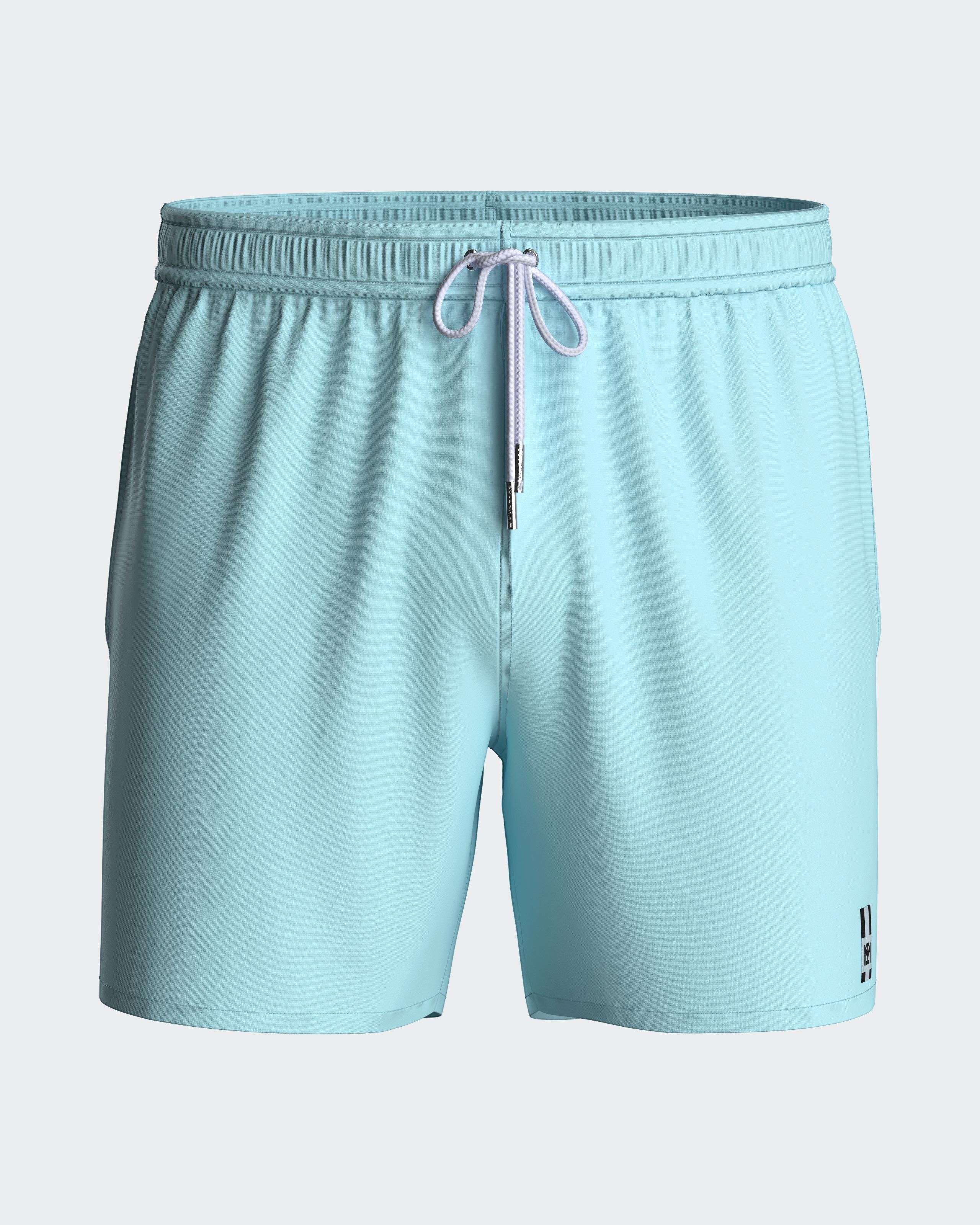 Maison Sarava light blue polyester men's swim shorts with adjustable drawstring waist and inner mesh lining.