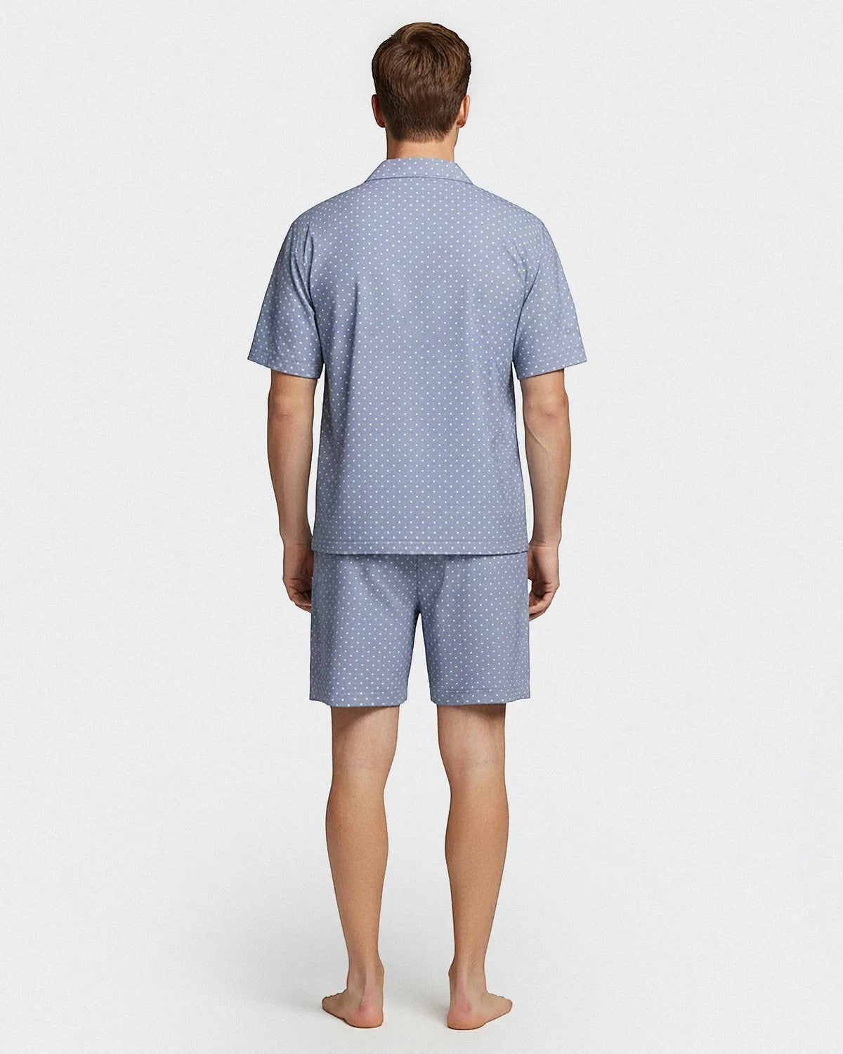 Maison Sarava men's light blue cotton lounge set with white polka dots. Short sleeve shirt and shorts.