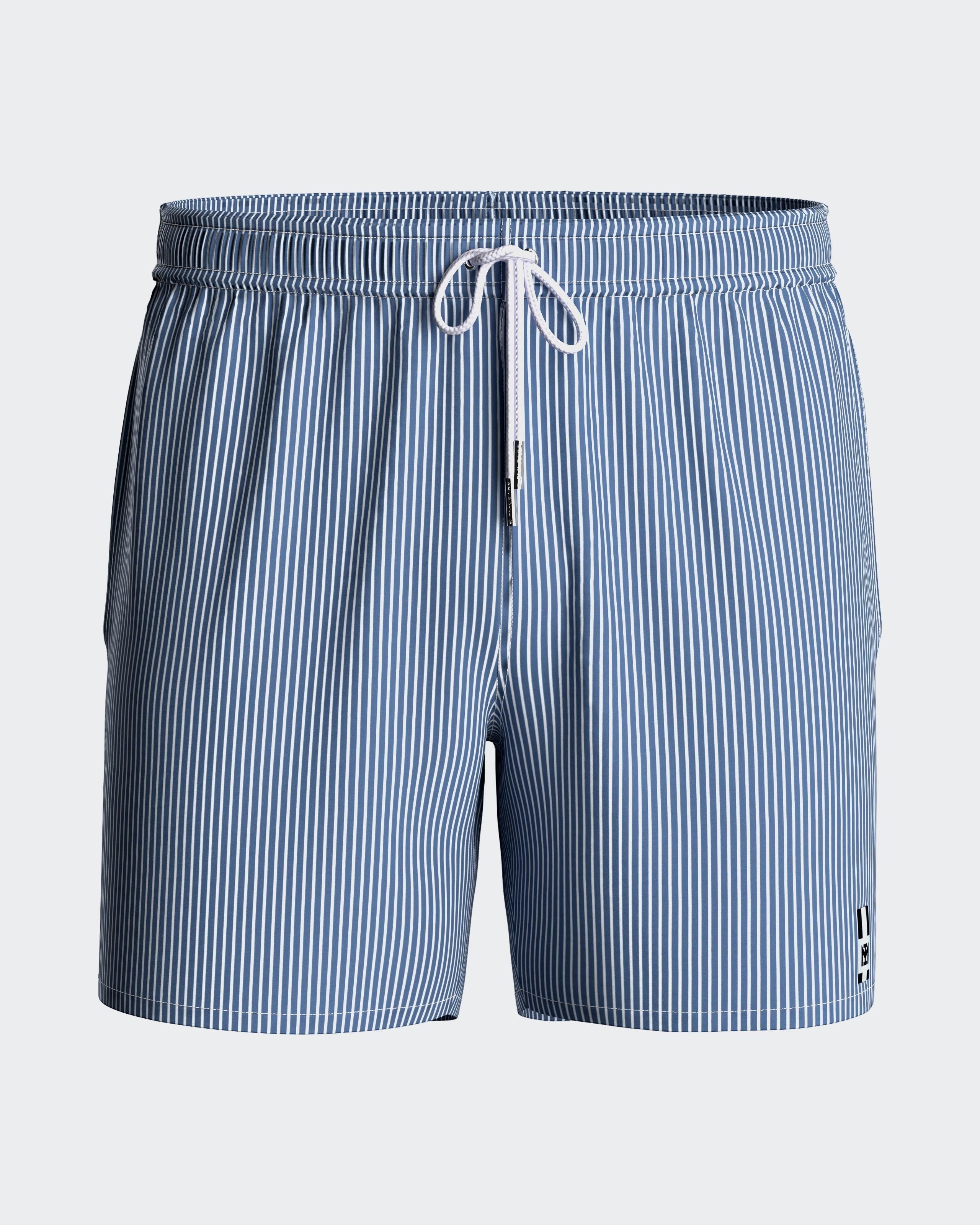 Maison Sarava blue and white striped men's swim shorts with drawstring and side pockets.
