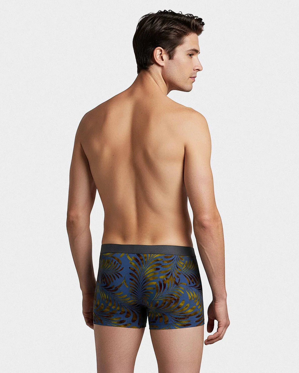 Maison Sarava men's blue boxer briefs with a tropical leaf print and grey elastic waistband, made from TENCEL Lyocell.