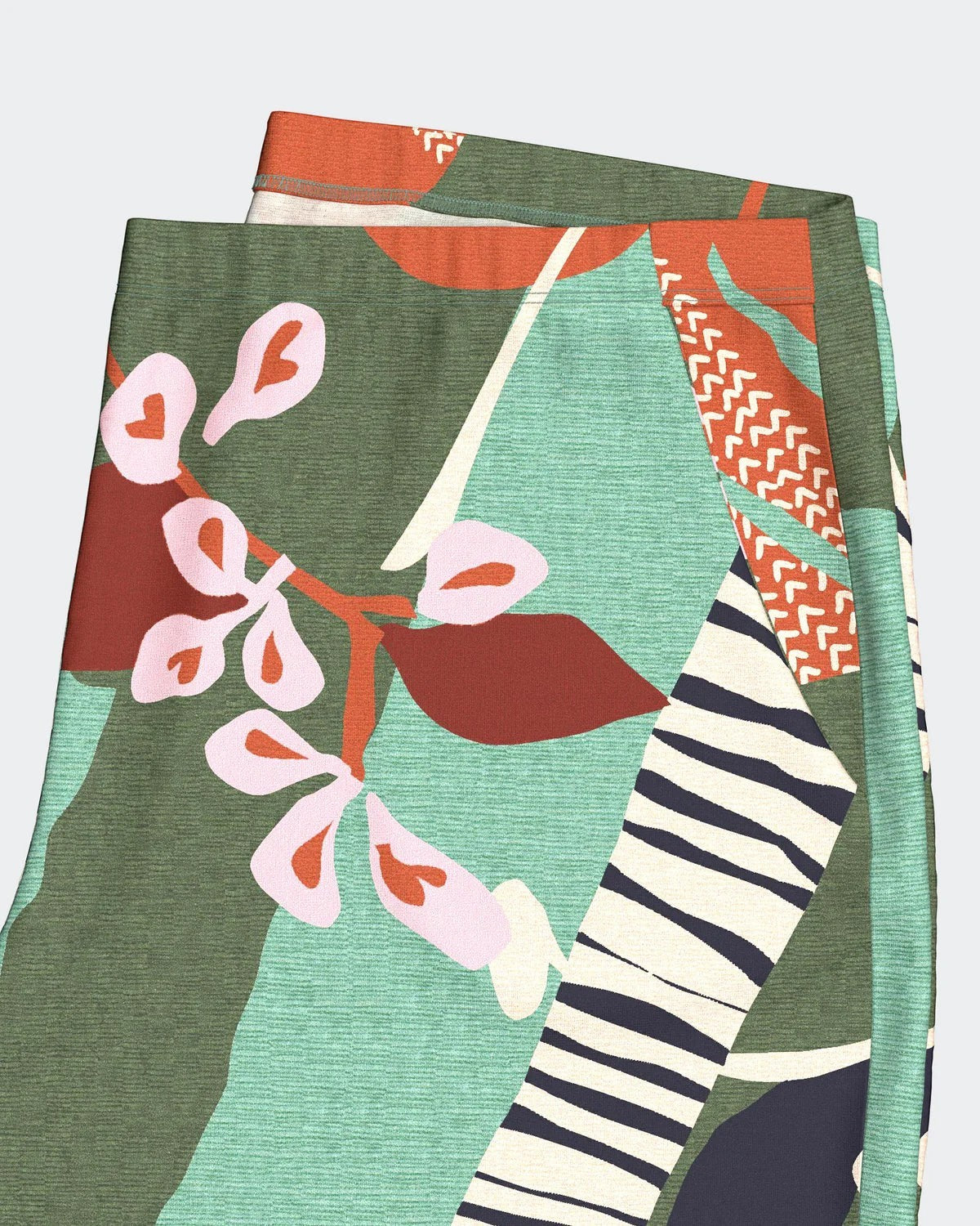 Maison Sarava women's modal lounge set with a botanical print in green, pink, and rust. Lightweight knit fabric.