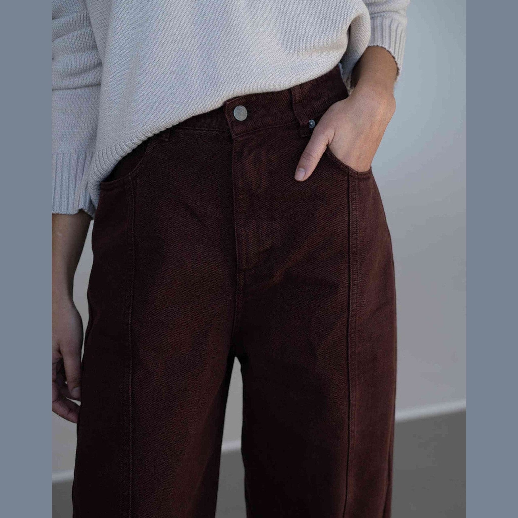 Maison Sarava brown denim Elsa trousers with a high rise waist and wide leg silhouette.