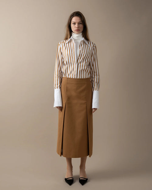 Maison Sarava women's straight-fit midi skirt in camel brown with double front vent and invisible back zip.