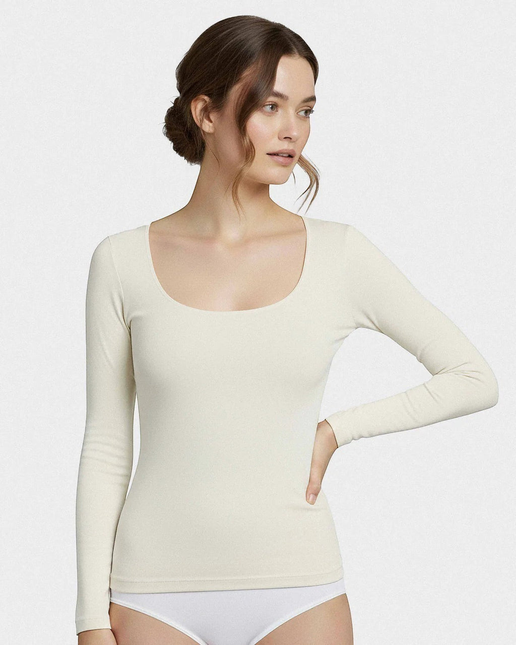 Maison Sarava women's cream long sleeve scoop neck tee made from a soft Merino wool and Lyocell blend.