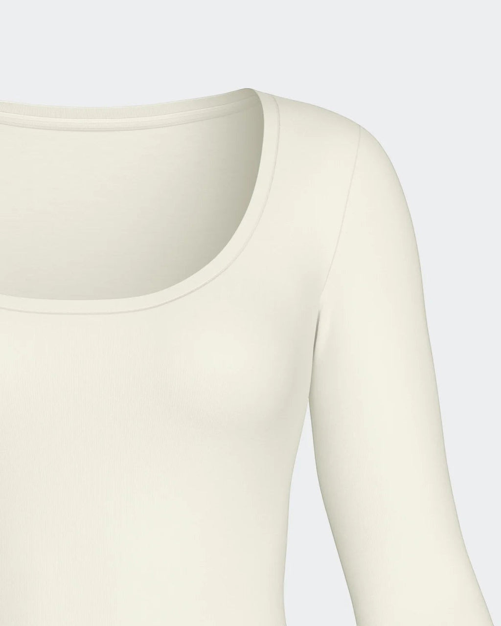 Maison Sarava cream long sleeve scoop neck tee made from soft Merino wool and Lyocell blend.