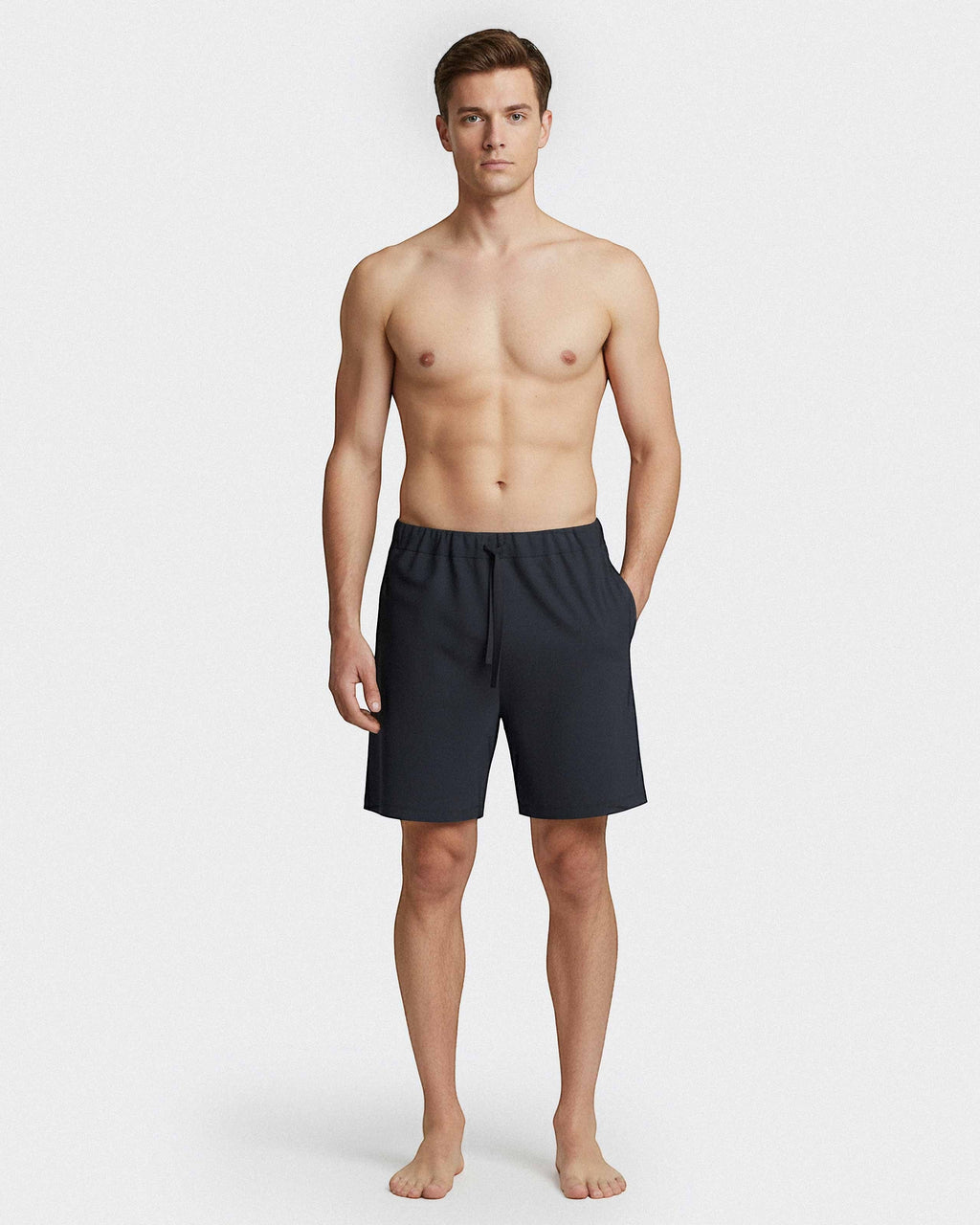 Maison Sarava dark grey lounge shorts with drawstring and side pockets, worn by a man.