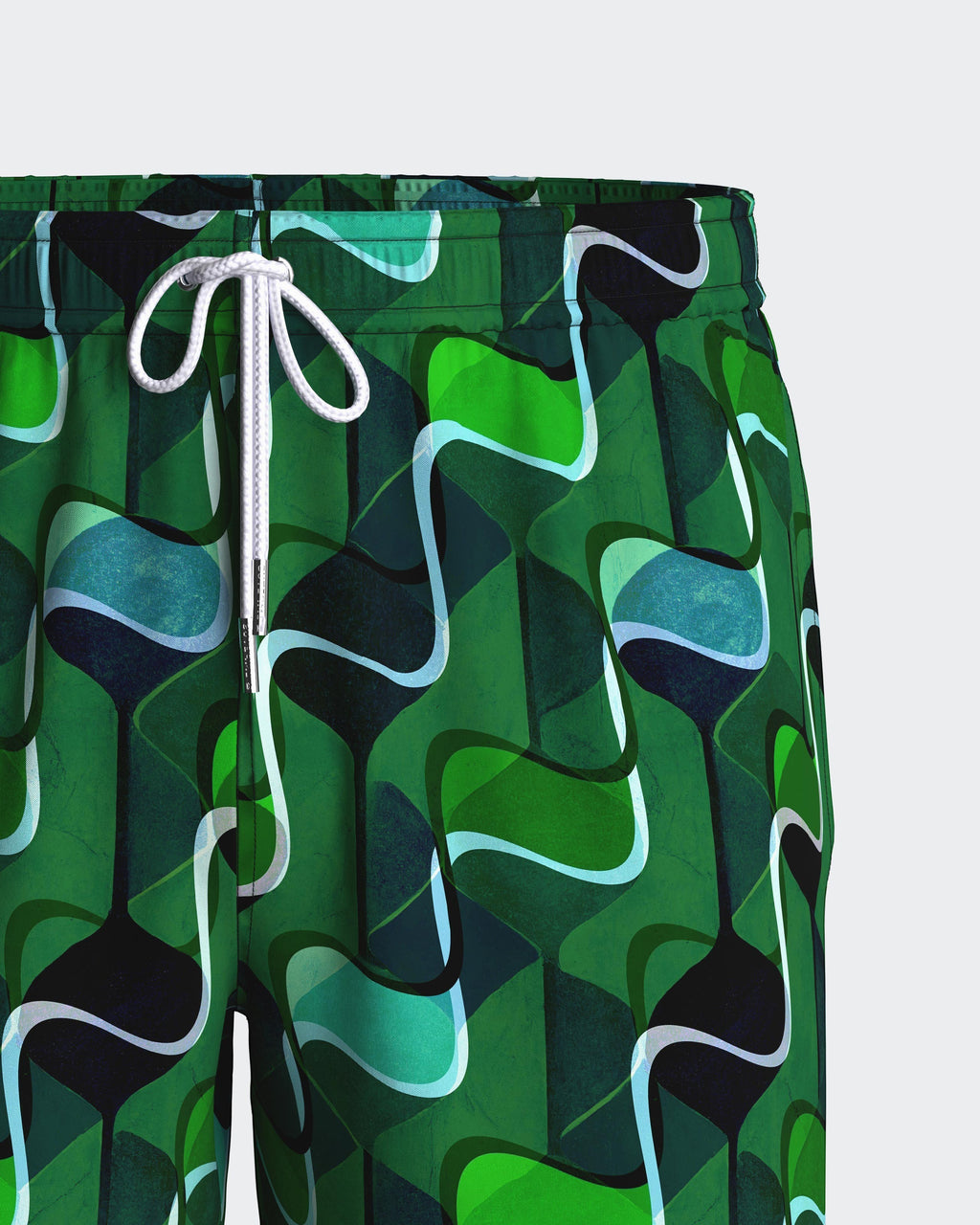 Maison Sarava men's green abstract pattern swim trunks with white drawstring and metal tips.