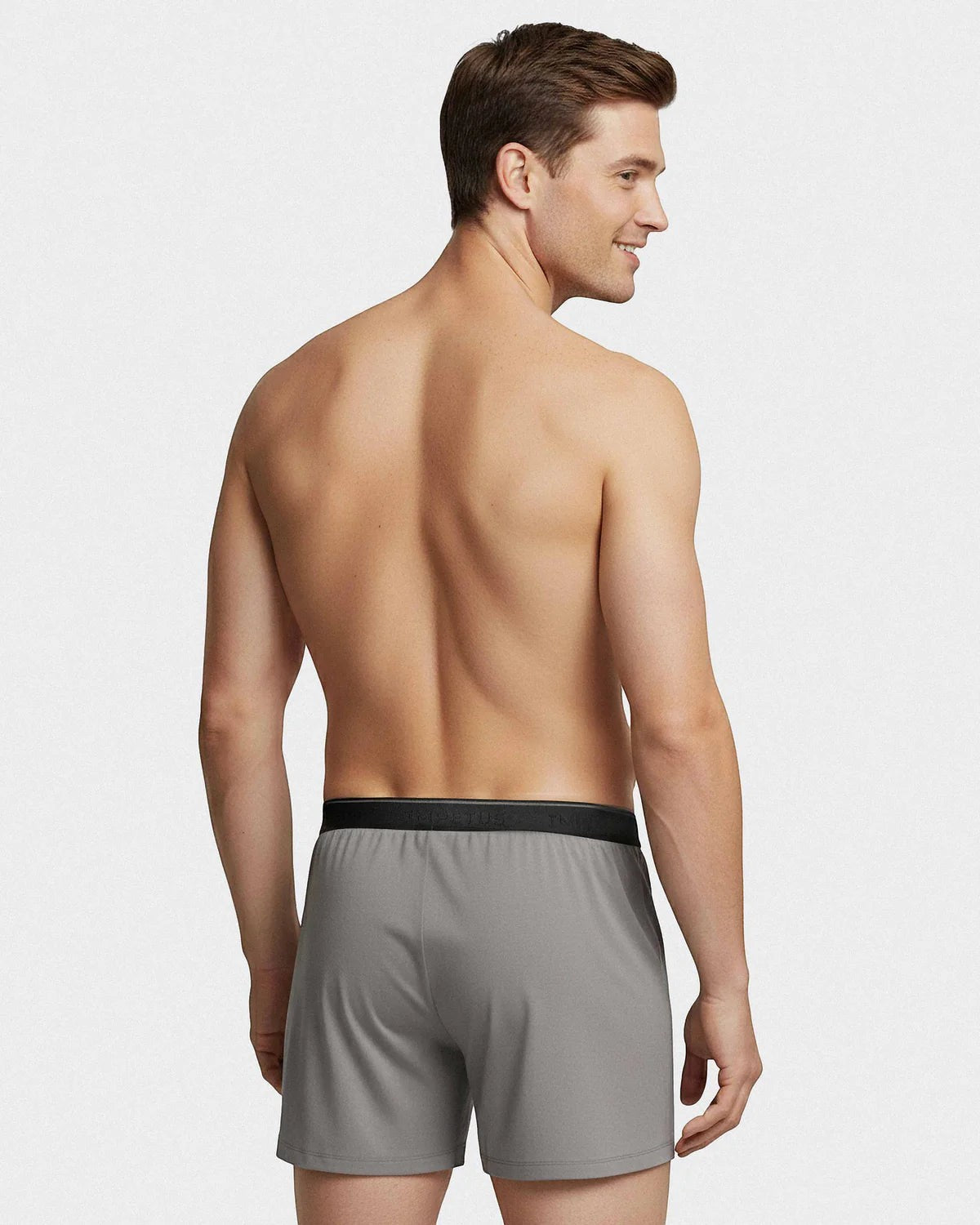 Maison Sarava grey classic boxer briefs with black elastic waistband and button fly, worn by a male model.