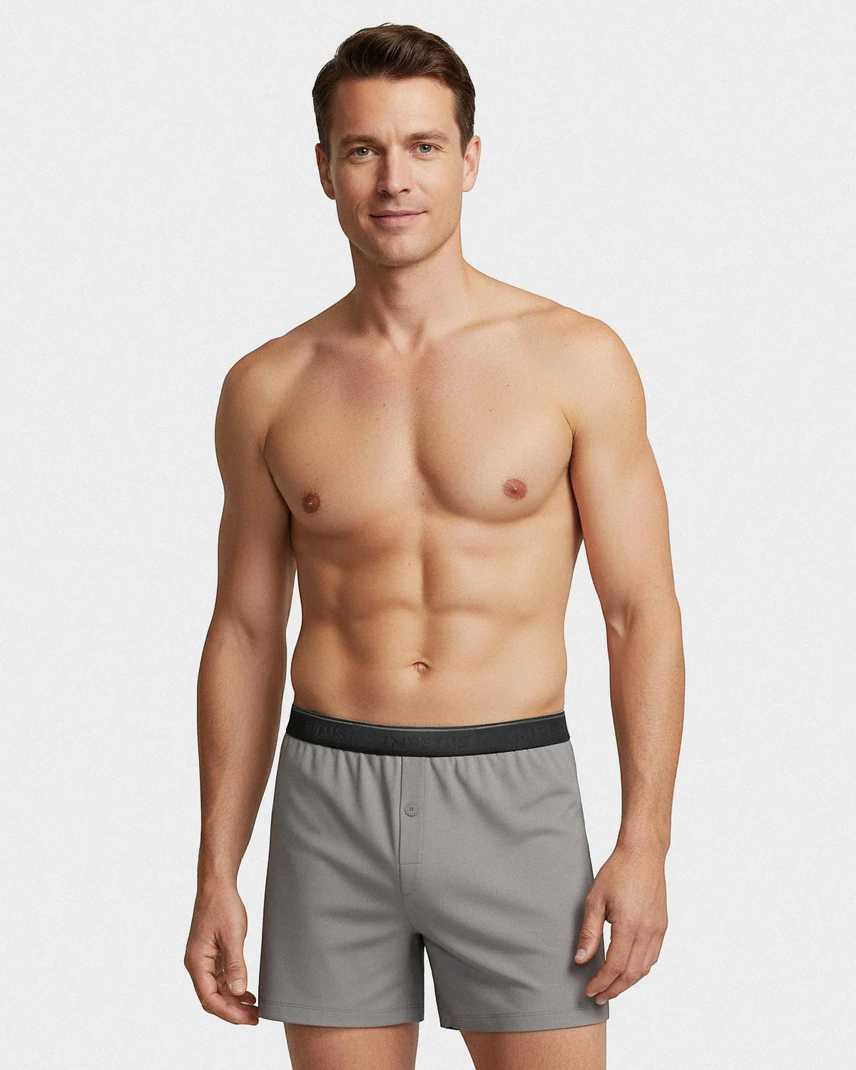 Maison Sarava grey cotton boxer briefs with black branded waistband and button fly, worn by a male model.