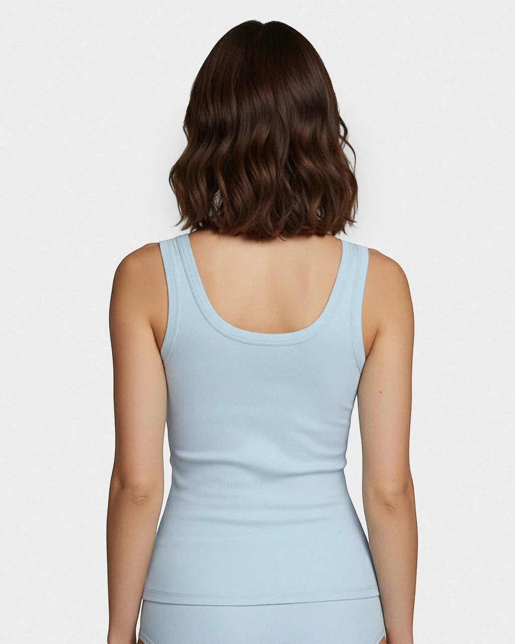 Maison Sarava light blue ribbed Lyocell tank top with wide straps, worn by a model.