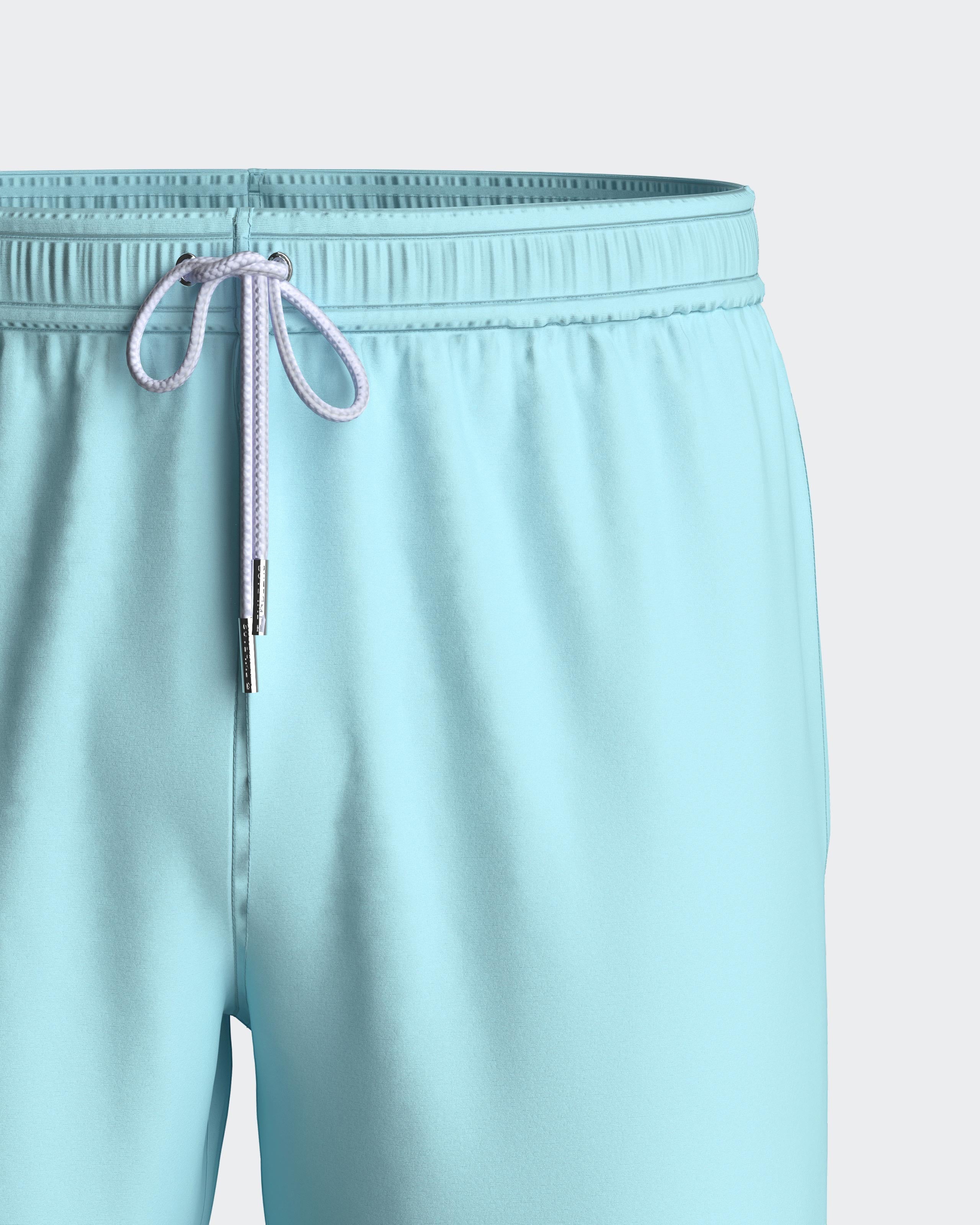 Maison Sarava light blue polyester men's swim shorts with adjustable drawstring waist and metal ends.