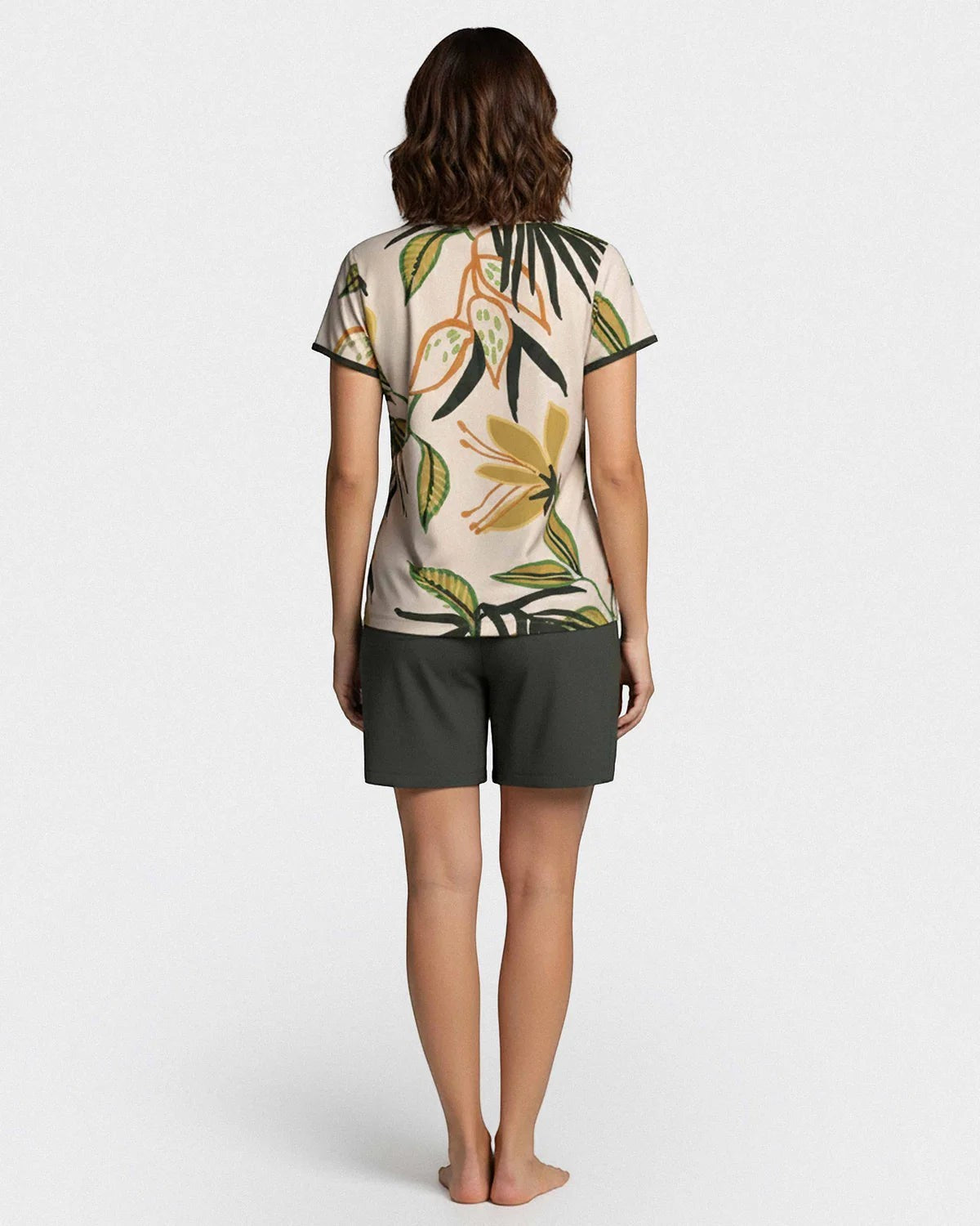 Maison Sarava women's short sleeve lounge set with tropical print top and plain dark green shorts made of Lyocell.