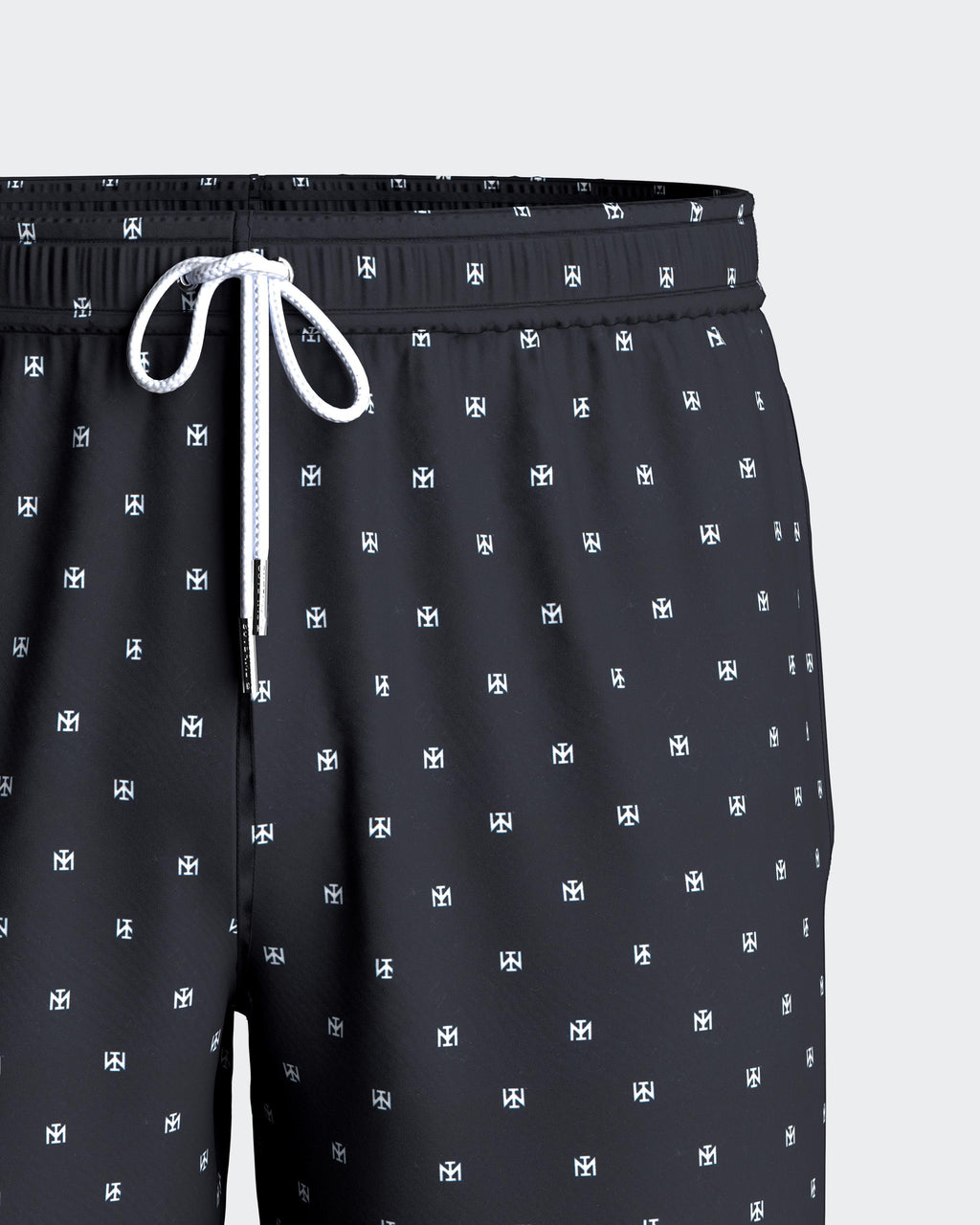 Maison Sarava men's black swim trunks with micro Impetus logo pattern, drawstring waist, side pockets, and inner mesh lining.