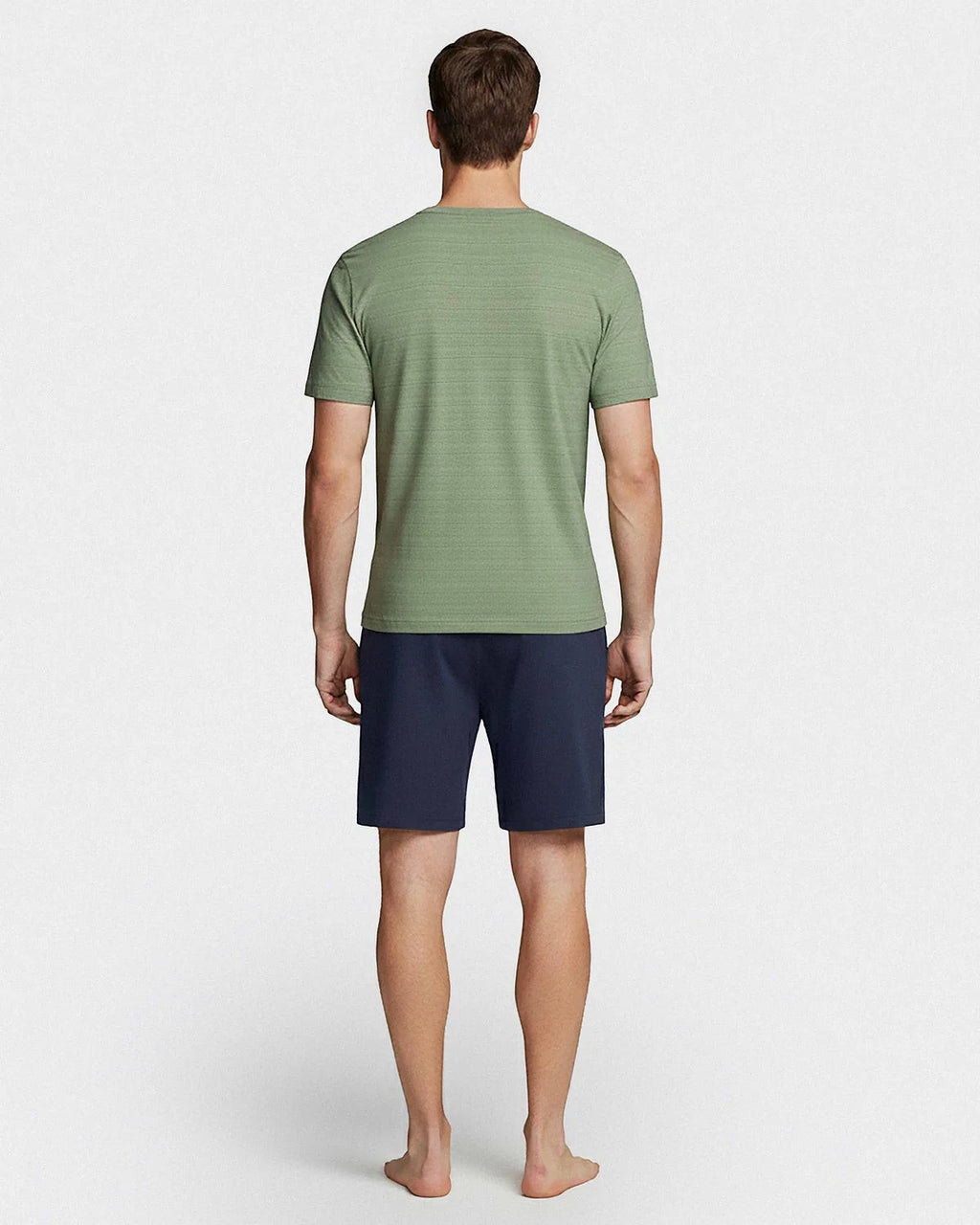 Maison Sarava men's green short sleeve V-neck t-shirt with fine line print and navy blue shorts with side pockets, made from TENCEL™ Modal.