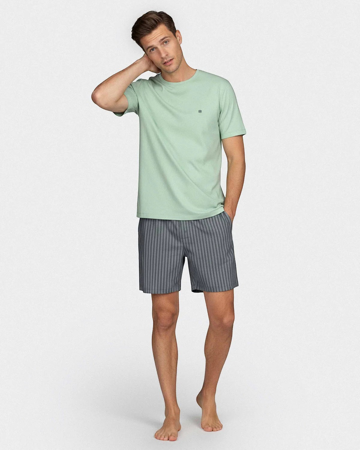 Maison Sarava men's light green modal short sleeve top with chest embroidery and grey striped lounge shorts.