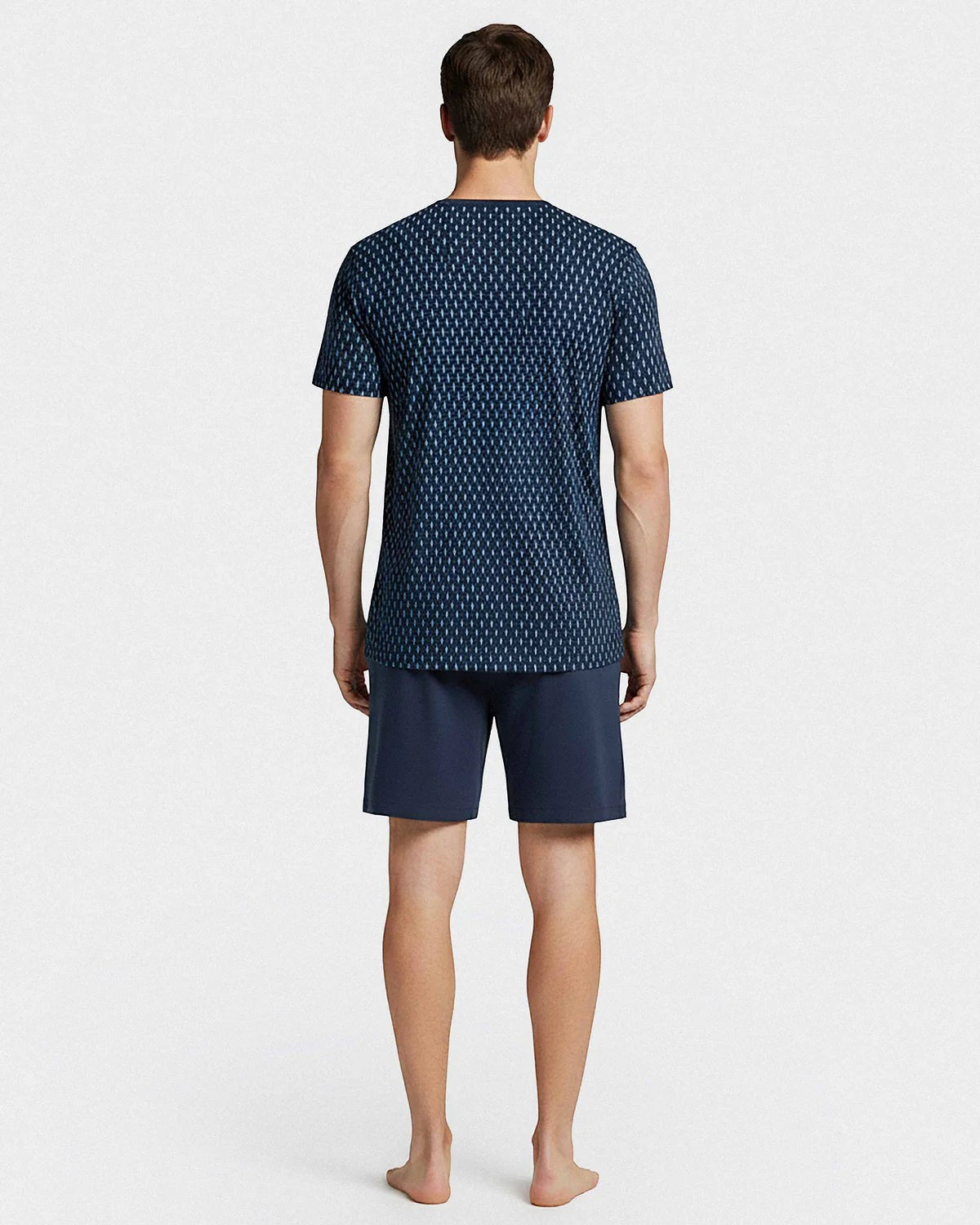 Maison Sarava men's navy blue cotton short sleeve lounge set with a geometric pattern on the t-shirt and solid navy shorts.