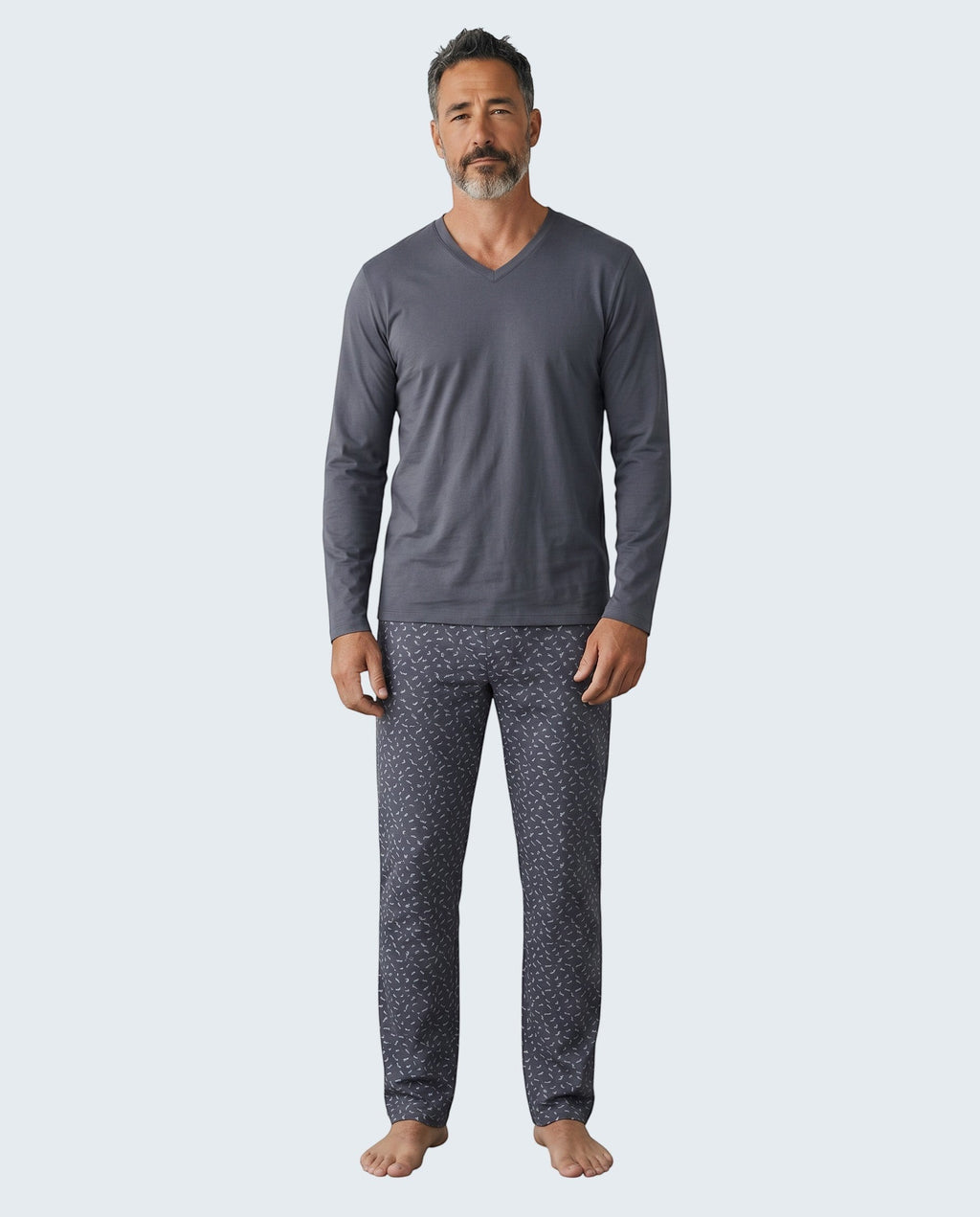 Maison Sarava men's dark grey long sleeve V-neck pajama top with patterned pants.