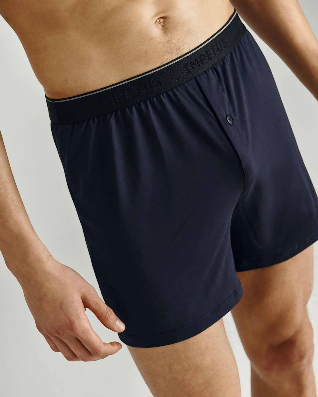 Maison Sarava navy blue classic boxer briefs with button fly and branded elastic waistband, made from soft breathable fabric.