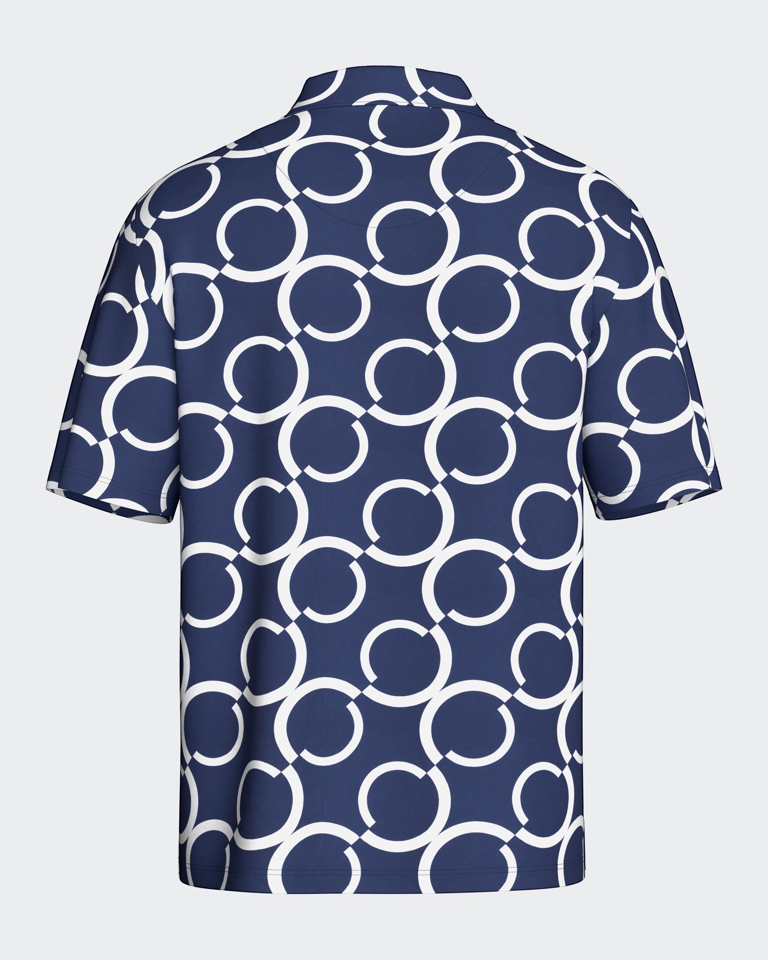 Maison Sarava navy and white geometric print short sleeve resort shirt with open collar.