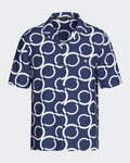 Maison Sarava navy and white geometric print short sleeve resort shirt with open collar.