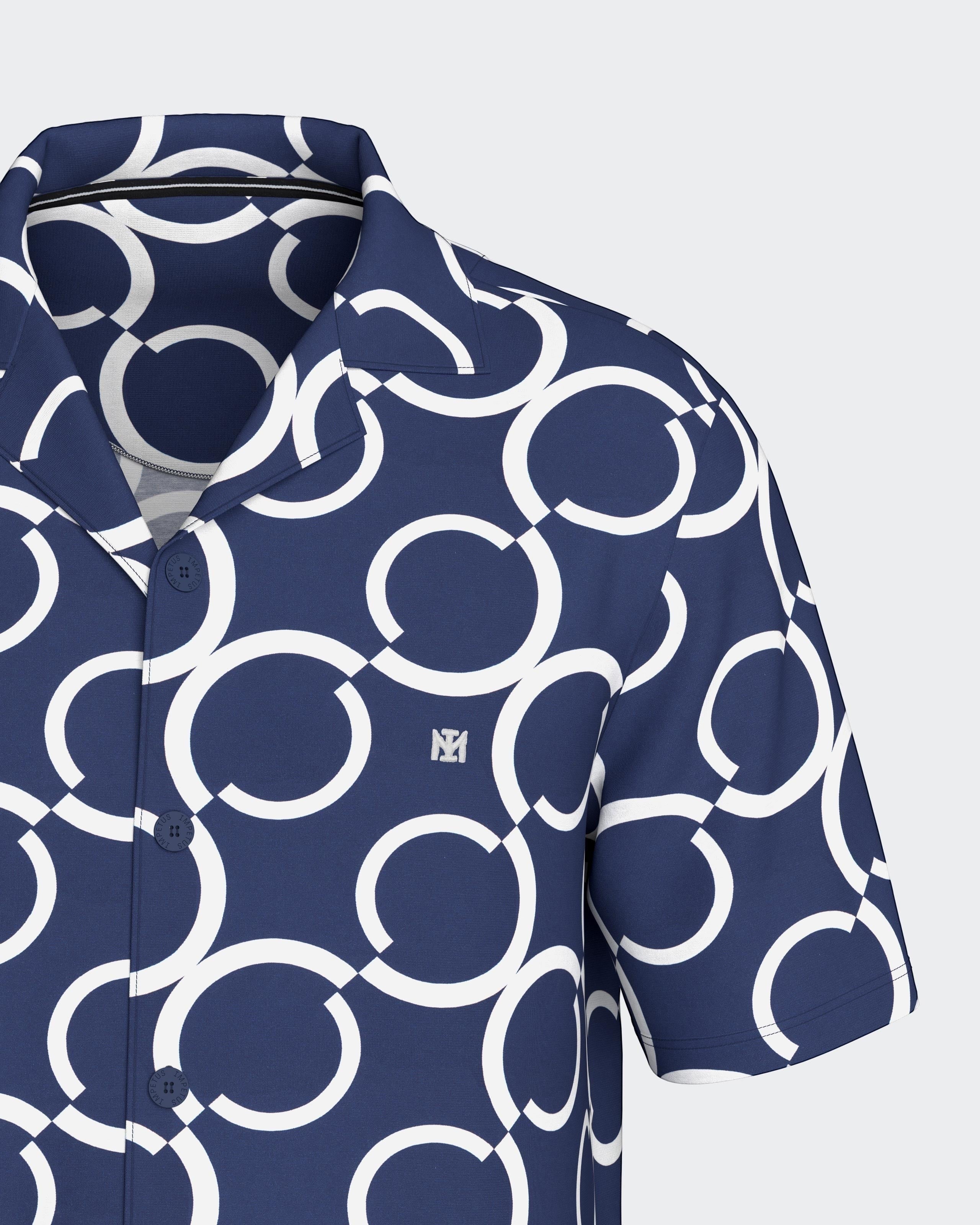 Maison Sarava navy and white geometric print short sleeve resort shirt with open collar.