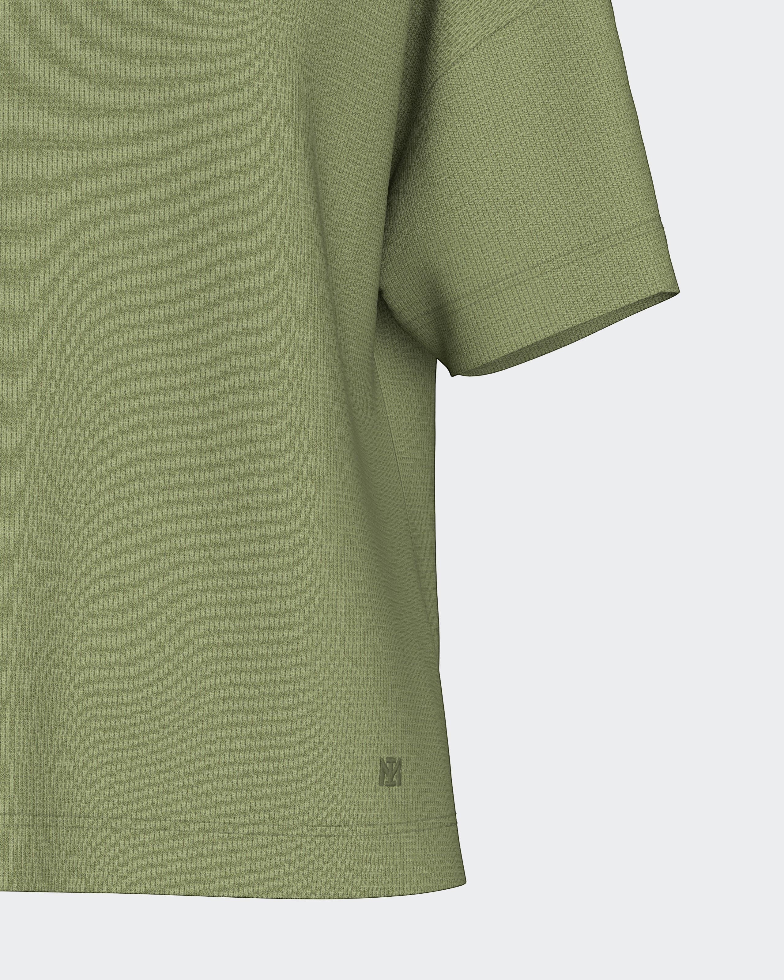 Maison Sarava women's olive green lyocell waffle knit short sleeve top with subtle logo detail.