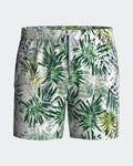 Maison Sarava men's white and green palm leaf print swim shorts with adjustable drawstring waist and inner mesh lining.