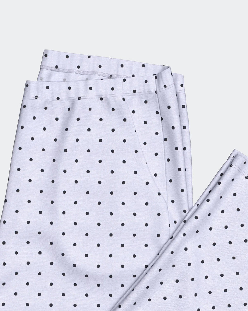 Maison Sarava women's light blue and black polka dot TENCEL™ Modal lounge set. Features lapel collar shirt and trousers with pockets.