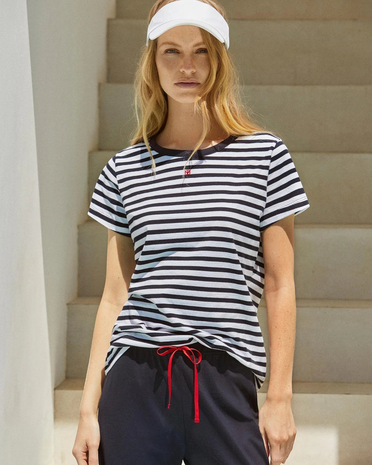 Maison Sarava women's navy and white striped cotton short sleeve lounge set with navy capri trousers and red drawstring.