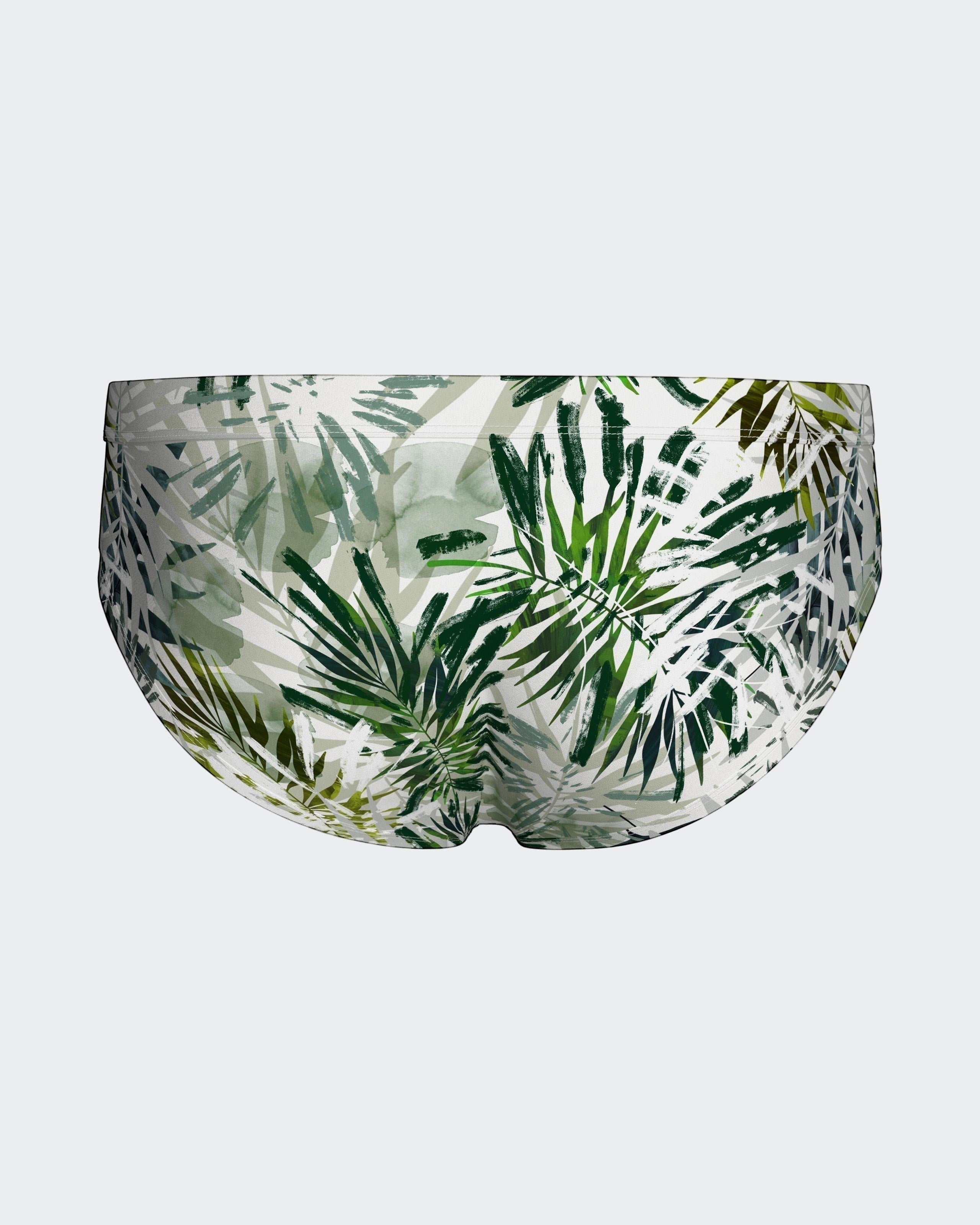 Maison Sarava tropical leaf print swim briefs in green and white. Form-fitting, quick-drying fabric.
