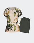 Maison Sarava women's short sleeve lounge set with tropical print top and plain dark green trousers.